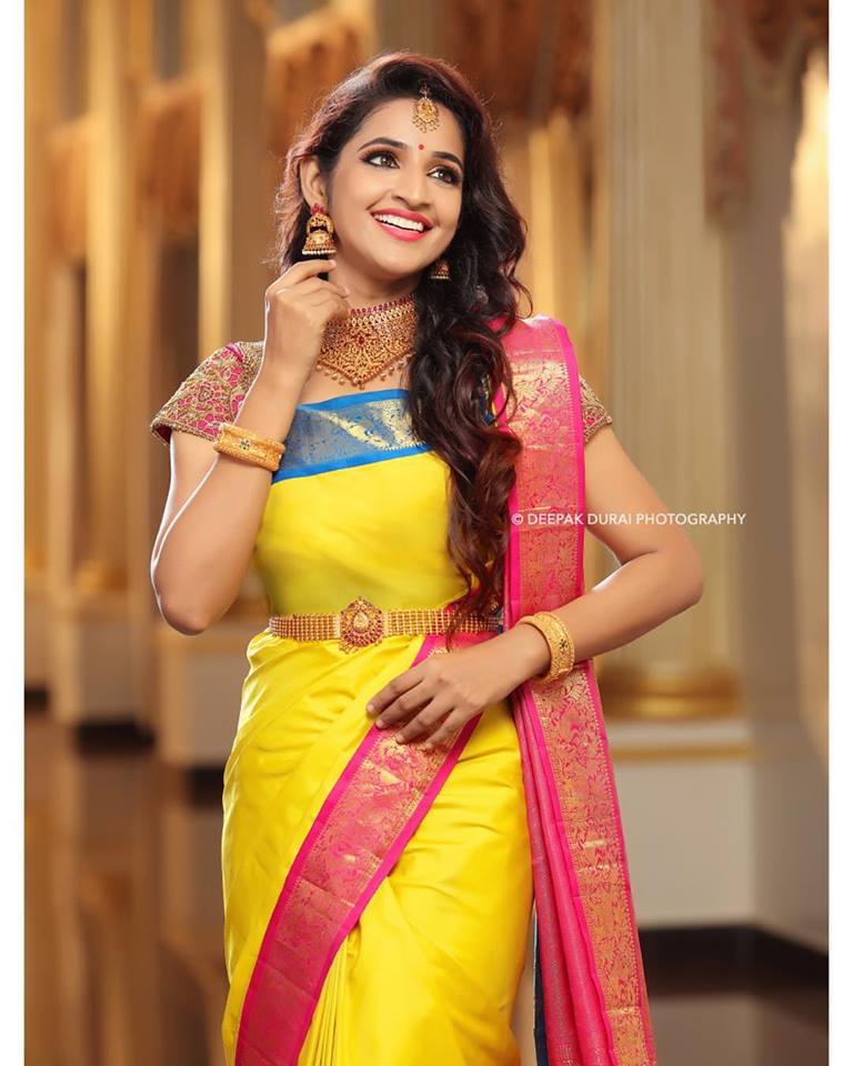 Yellow silksaree with pink and blue border 